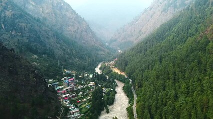 Wall Mural - Aerial view of himalayan mountains at kasol himachal pradesh. Small villages and colorful local houses nested in the hills of parvati valley at kasol, himachal pradesh, India.