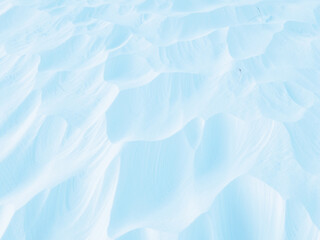 Wall Mural - snow texture. wind sculpted patterns on snow surface. wind in the tundra and in the mountains on the