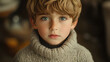 © Priyanut - A young boy wearing a woolen sweater staring thoughtfully, soft natural lighting and expressive mood