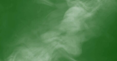Wall Mural - smoke slowly floating through space against chroma key green screen