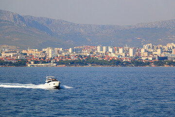 Wall Mural - Contemporary buildings, gardens and beaches at the waterfront in Split, Croatia. View of Split from the boat.