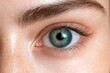 © Usman - Close-up of a woman's eyes featuring a bright and unique pupil color.