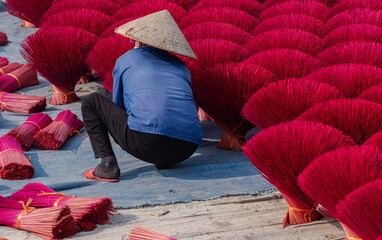 Quang Phu Cau village in Hanoi, Vietnam is famous for its century old craft of making incense. Drying incense sticks in Quang Phu Cau handicraft village. Travel and landscape concept.