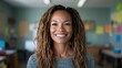 © svastix - This image features a radiant woman with a joyful expression and dreadlocks standing confidently in a classroom filled with colorful inspirations. Perfect for positive messaging.