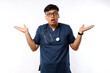 © ArvStd - Healthcare workers concept. Surprised and amazed asian male nurse, physician in medical and scrubs raising hands up excited, hear amazing news, white background