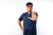 © ArvStd - Healthcare workers concept. Serious-looking displeased asian doctor, nurse in scrubs stopping you, show prohibit, warning gesture, forbid patient