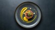 © ElenaX - Elegant gourmet dish with artistic presentation on dark plate