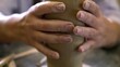 © Media Whale Stock - An Artisan is Engaged in the Creative Process of Forming Clay Pottery on a Work Surface. Stock Clip