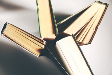 Poster - stack of book on wooden table