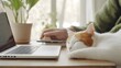 © NN AI - Ginger cat sleeping near laptop with houseplants, remote work lifestyle concept for home office blogs, pet-friendly workplace materials and digital nomad content