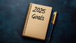 © Oleksandr - Notebook showing 2025 goals and pen on blue background