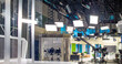 © serhii - abstract background with interior of TV studio with filming and lighting equipment for banner background