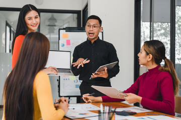 Wall Mural - Team discussing ideas in modern office with enthusiasm