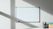 © Tati - Empty whiteboard on wall, colorful markers in holder, shadows