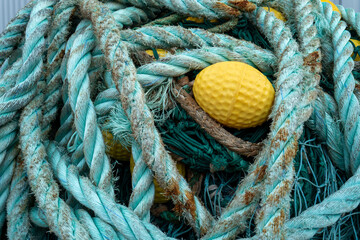 Wall Mural - tangled discarded fishing ropes, nets and Buoy