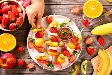 Wall Mural - delicious and juicy fruits skewer and chocolate sauce for dipping sauce