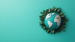 © Arfa_Media - Earth globe surrounded by leaves symbolizing environmental conservation on turquoise background