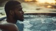 © dominic - Man Relaxing in Ice Bath, Cold Plunge Therapy, Wellness Ritual