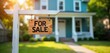 © Viktor - Wooden sign says FOR SALE hangs from white post. Teal house with porch, lawn in background. Real estate property sale advertisement. Home for sale concept. Exterior of residence. Property for
