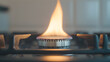 © photo for everything - A close-up view of a modern kitchen stove, with a gas flame burning brightly on the burner, showcasing its clean and efficient design in a contemporary kitchen setting