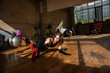 © Дмитро Петрина - A girl dances a contemporary dance in a sunlit studio