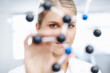 © peopleimages.com - Science, portrait and woman with molecule structure for hypotheses testing and behavior of atom in biology system. Scientist, professional and 3D model with analysis for compound property prediction