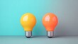 © Galib - Two light bulbs sit side by side, one yellow and one orange, against a blue and gray background.