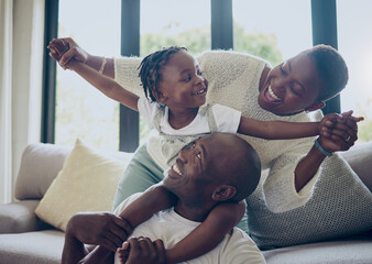 Wall Mural - Black family, smile and piggyback fun in home, happy kid and support with fly games in lounge. Love, parents and daughter together for security in relationship, care and couch for playful bonding