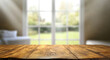 © TAMER YILMAZ - Top of wood table counter on blur window view garden background.
