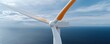© Nattapol - Wind turbine closeup against blue sky renewable energy coastal view