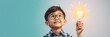 © Pimchada - Smart Asian boy child with a light bulb above his head, having a creative idea while brainstorming on a blue banner background, innovation, boy, thinking