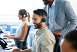 © peopleimages.com - Call center, help and man in training with leader for learning telemarketing and customer service. Advisor, coaching and people on computer for consulting advice, support or question in business