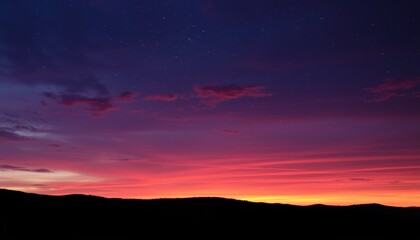 Wall Mural - vibrant sunset sky over silhouetted mountains