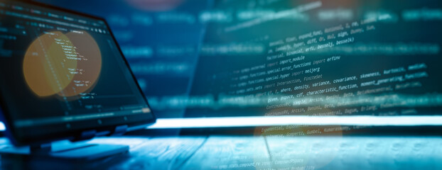 abstract software development concept with code and laptop on blurred background representing progra