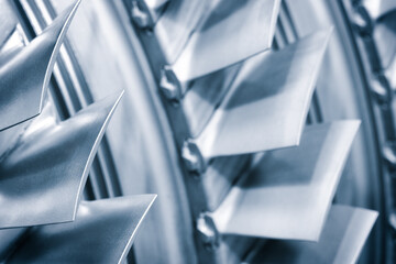 Aufkleber - A close up of a turbine with many blades. The blades are silver and are angled at different angles