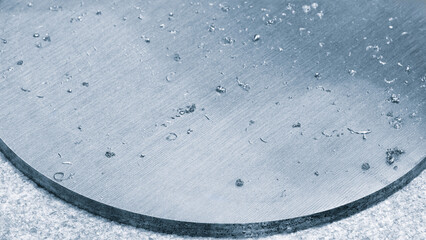 Fototapete - A metal plate with a lot of scratches on it. The plate is silver and has a lot of water on it
