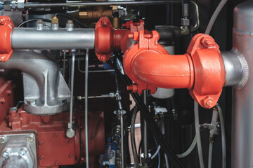 Aufkleber - A red pipe with a white cap. The pipe is attached to a machine
