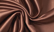 © Lisa - Elegant smooth coffee, cocoa or brown satin fabric with rich texture. Abstract monochrome elegant luxury silk cloth background. Mocha Mousse color of year 2025.
