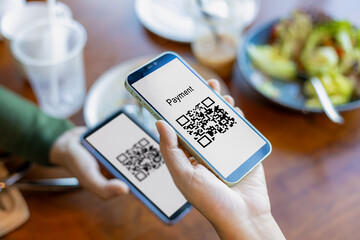 hand using mobile phone application to scan qr code, hands holding mobile phone, qr code payment or 