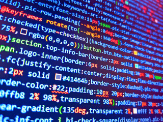 web development code on screen. binary code. work of software developer programmer on desktop screen