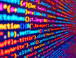 © Maciej - Blurred photo, colorful background, color texture. Blue software developer. Pixelated lines of computer code displayed on a digital screen with blurred focus background. 3d rendering.