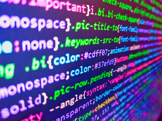 assembly programming language code. website codes on monitor. business graph background. application