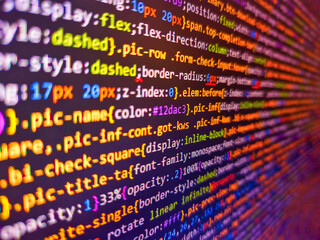computer html code on screen. closeup of a stock market ticker with red and green numbers. color cod