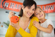 © auremar - mother and daughter getting ready for halloween