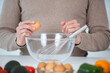 © auremar - a woman is whisking eggs