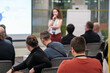 © Anton Gvozdikov - Diverse group participating in a business seminar, focusing on speaker presentation. Audience engaged, learning in a professional setting with visual aids enhancing understanding and collaboration.