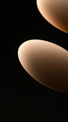 Wall Mural - two illuminated ovals are partially visible against a dark backdrop, creating a gradient effect as l