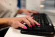 © Robert - Closeup of female hands typing on a computer keyboard in a modern office.Closeup of businesswoman hands typing on computer keyboard at office desk. Closeup of a woman's hand using a computer mouse and