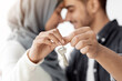 © Prostock-studio - Closeup of key chain in loving muslim couple hands, selective focus. Happy middle-eastern family husband and wife showing key from their apartment, celebrating moving to new house