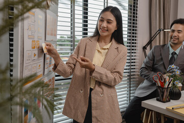 Wall Mural - ux developer and ui designer brainstorming about mobile app interface wireframe design in the office